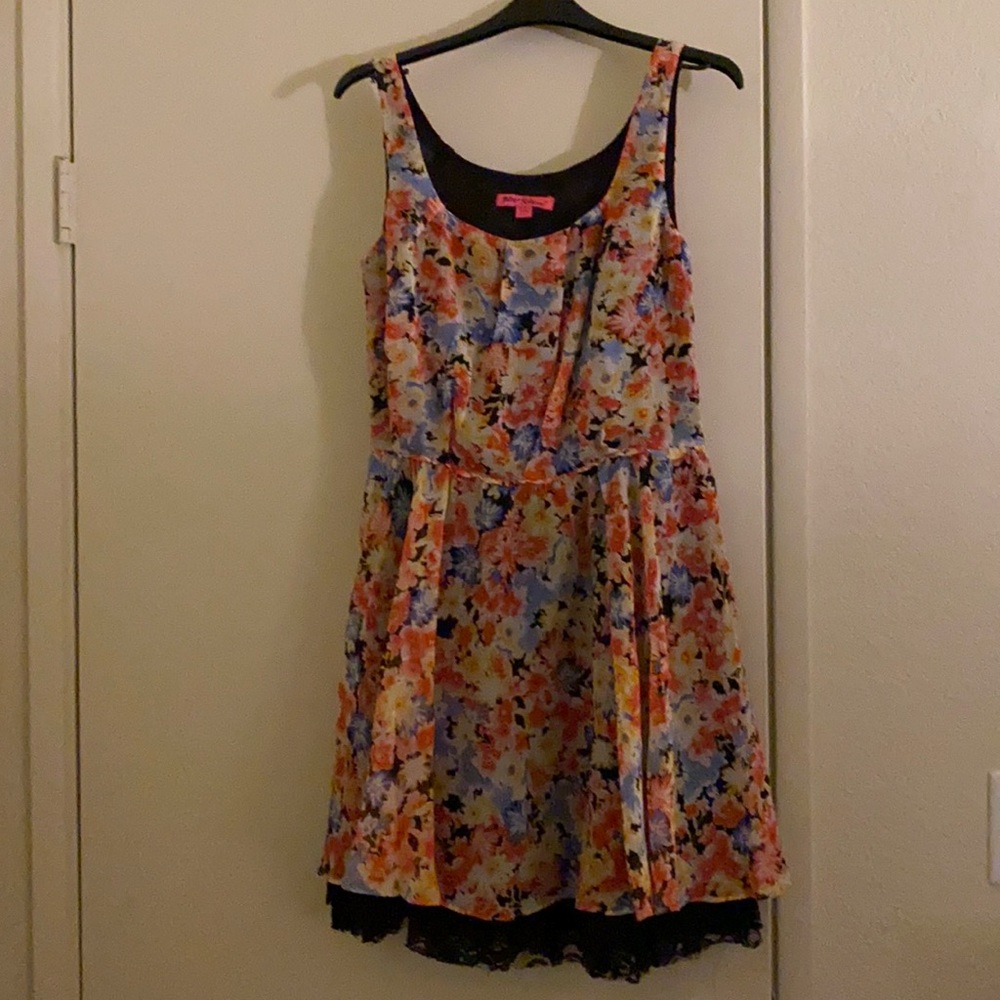 Floral mini dress with lace trimmed underskirt by Betsey Johnson.